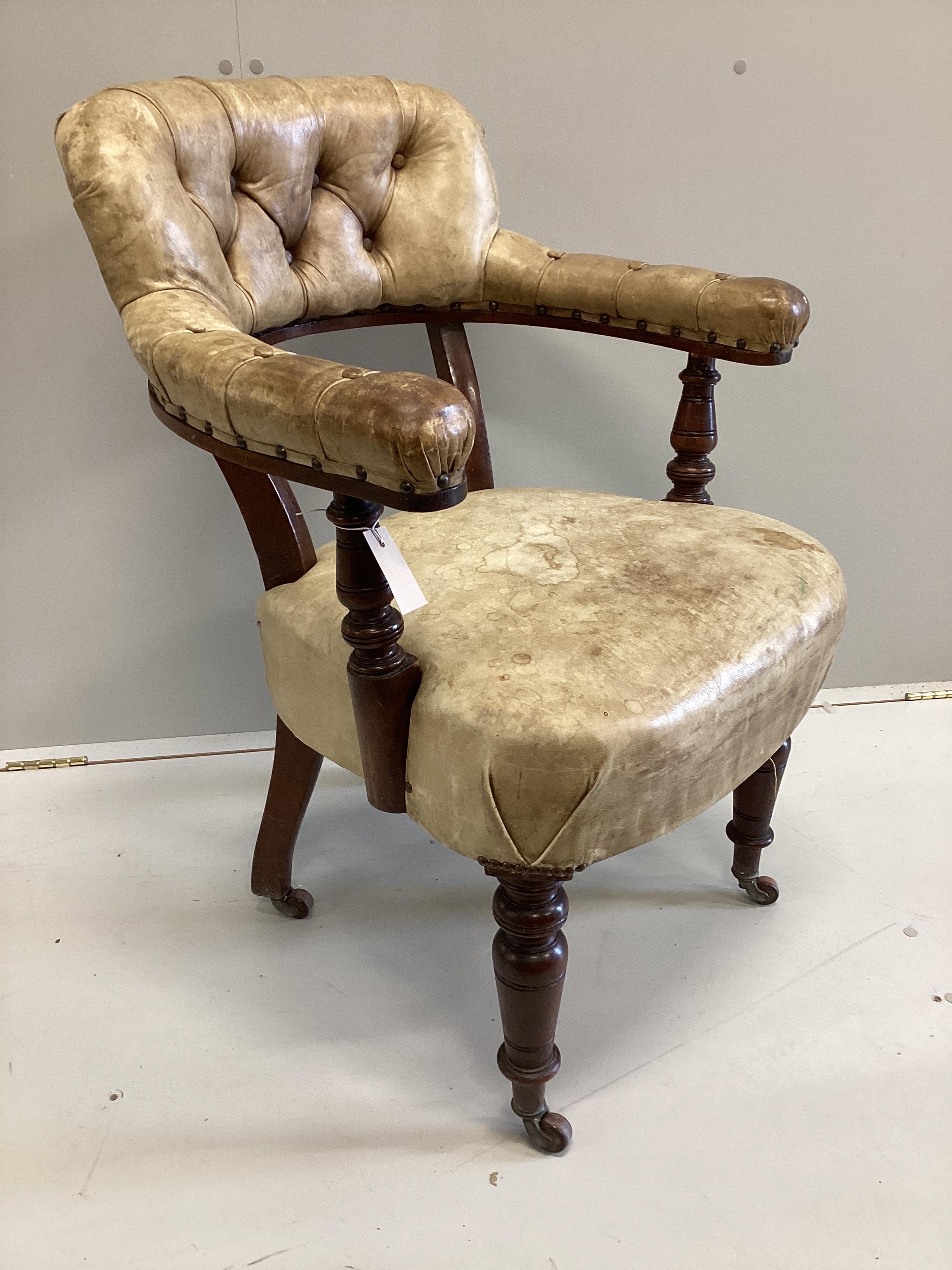 A late Victorian mahogany and buttoned leather tub frame desk chair, width 62cm, depth 50cm, height 90cm